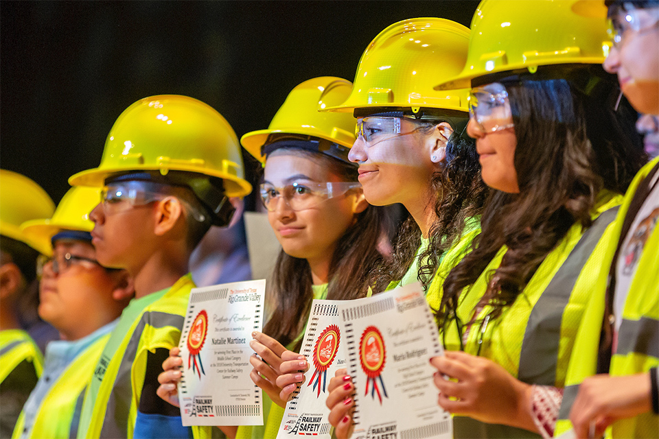 The UTRGV Railway Safety Camp, led by Dr. Constantine Tarawneh, director of the UTRGV Transportation Center for Railway Safety and associate dean for research and graduate programs in the College of Engineering and Computer Science, is the largest transportation-related camp in the nation and already has expanded to include middle school and elementary students from around the Rio Grande Valley. This year, more than 1,200 students from more than 26 local school districts participated in the camp. Students shown here are from the 2018 Railway Safety Camp closing ceremony. (UTRGV Photo by Paul Chouy)