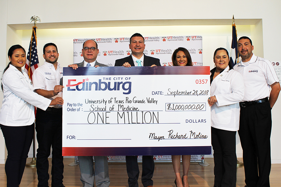 The City of Edinburg continued its support of the UTRGV School of Medicine by presenting a $1 million check to help fund educational, research and clinical endeavors. Pictured from left to right are: UTRGV Medical Student Pamela Matias, City Councilmember Jorge Salinas, UTRGV School of Medicine Dean John H. Krouse, Mayor Richard Molina, UTRGV Vice President for Governmental and Community Relations Veronica Gonzales, UTRGV Medical Student Rachel Salinas, and City Councilmember Gilbert Enriquez. (Courtesy Photo)