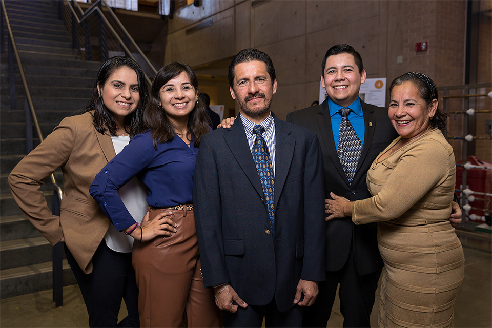 Master’s student graduates with support from family