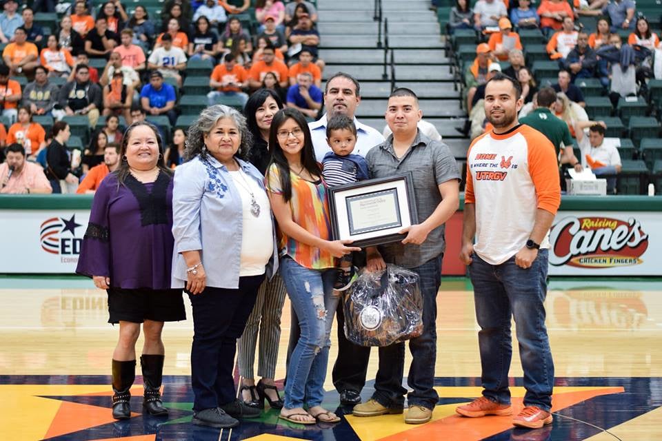 Amanda Cruz here surrounded by her son, husband and other family members.