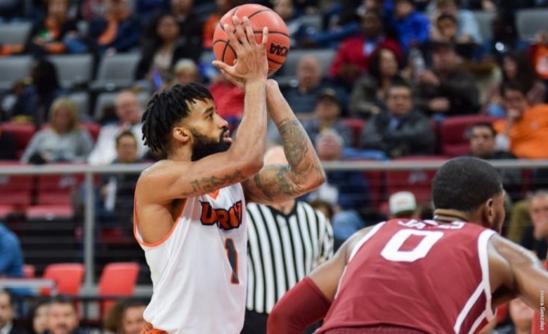 UTRGV basketbsll player shooting for a point