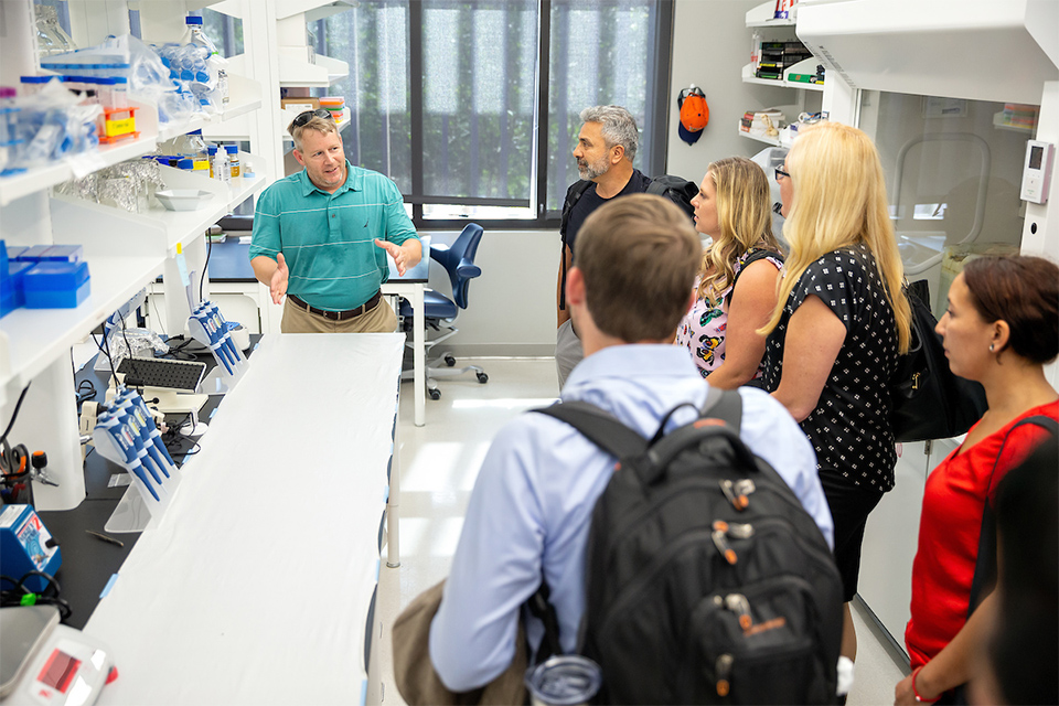 Dr. John Thomas, UTRGV associate professor of Biology, led a tour of his research laboratory, during the third annual Progress Meeting of the Western Gulf Center of Excellence for Vector-Borne Diseases, held June 20-21, 2019 at the Medical Education Building on the Edinburg Campus. (UTRGV Photo by Paul Chouy)