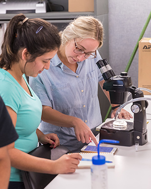 Students from three universities, including UTRGV, traveled across Texas to get field experience in outbreak investigation and learn about the One Health initiative, as part of a cooperative course between UTRGV, Texas A&M University and The University of Texas Medical Branch at Galveston. Dr. Christopher Vitek, UTRGV associate professor of biology, said there are different activities planned at each campus. ‘We’ll take all these different activities as if it’s an actual outbreak – an actual unidentified case – that they’re working to resolve,’ he said. Here, participating students visited the U.S. Department of Agriculture’s Cattle Fever Tick Research facility at Moore Air Base in western Hidalgo County to learn how to identify disease-carrying ticks. (UTRGV Photo by David Pike)