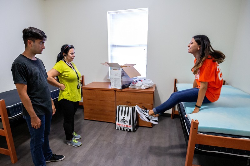 Entering freshman Daniela Mauriz and her mother and brother.