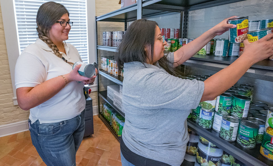 September is Hunger Action Month, a time to take a pro-active part in ending hunger. At UTRGV, student food pantries on both the Edinburg and Brownsville campuses work year-round to help ease food insecurity for a surprising number of university students. Here, social work major Jacquelyn Herrera (at left), manager for the Student Food Pantry on the Brownsville Campus, and Cristina Vega, program coordinator of the UTRGV Student Food Pantry, restock shelves in the Brownsville Campus pantry, in its new location in TSC Calvary Hall. (UTRGV Photo by David Pike)