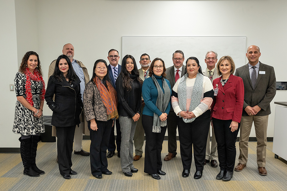 The UTRGV College of Education and P-16 Integration held a meeting recently with area superintendents about Project PLEASE, a new grant-funded program that will select 14 teachers from nine area school districts to participate in a doctorate program specializing in special education. Front row from left are: Andrea Garza, Magda Villarreal, Dr. Hsuying Ward (principal investigator on the grant), Dr. Diana Villarreal, Dr. Silvia Ibarra, Maribelle Elizondo and Dr. Velma Menchaca. Back row from left are: Dr. John Lowdermilk, Dr. Sergio Garcia, Rashad Rana, Dr. Steve Chamberlain, Dr. Tim Cuff and Dr. Fred Guerra. (UTRGV Photo by Paul Chouy)