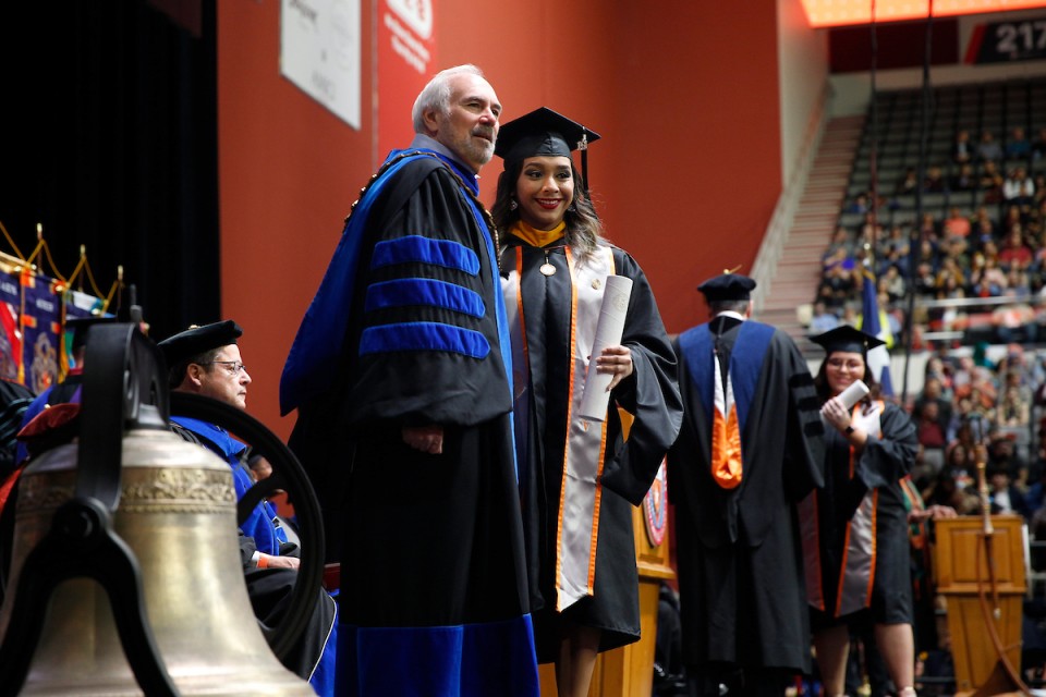 UTRGV graduate poses with University President