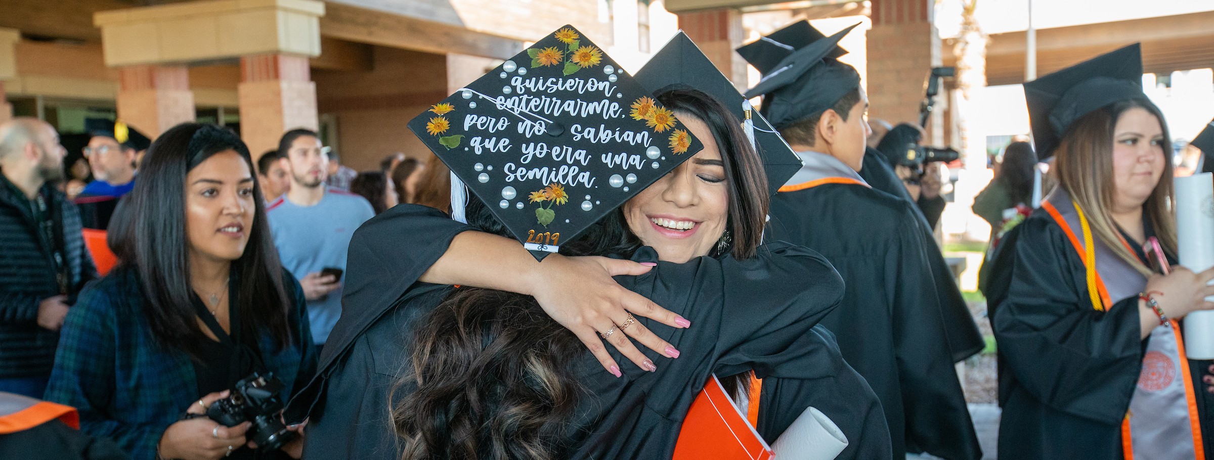 Fall Commencemnt graduates congratulate each other