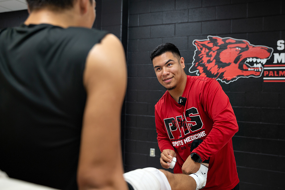 UTRGV alum Edwin Gomez, now an athletic trainer for his alma mater, Palmview High School, says he interned with the NFL’s Tennessee Titans, and that experience became the catalyst for his career. Gomez graduated from UTRGV in 2016 with a bachelor’s degree in Kinesiology, which, along with the Titans internship help lead him to his job today. (UTRGV Photo by Paul Chouy)