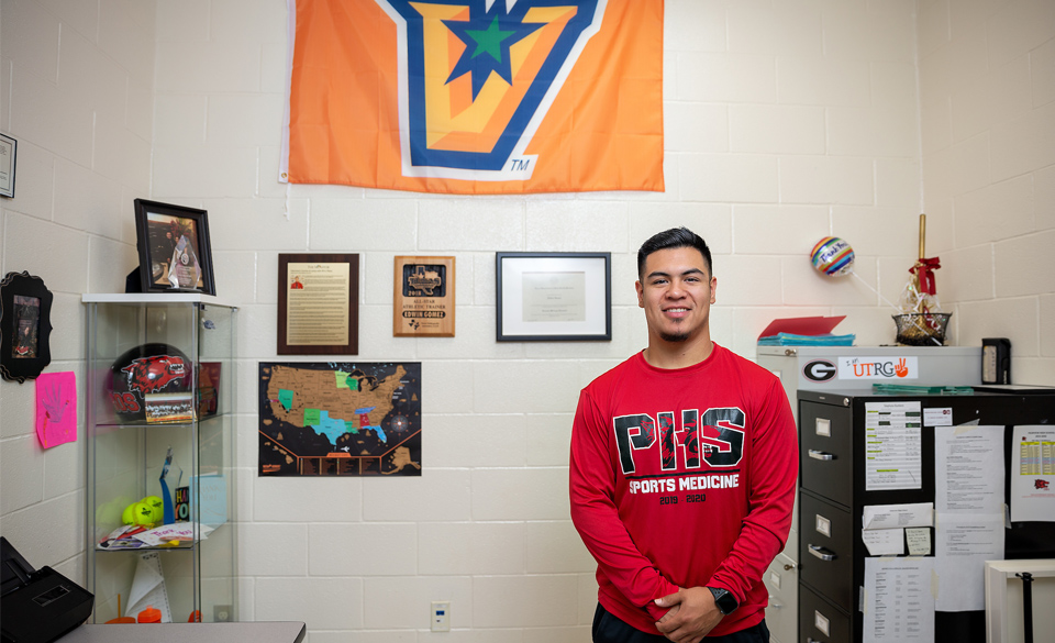 UTRGV alum Edwin Gomez, now an athletic trainer for his alma mater, Palmview High School, says he interned with the NFL’s Tennessee Titans, and that experience became the catalyst for his career. Gomez graduated from UTRGV in 2016 with a bachelor’s degree in Kinesiology, which, along with the Titans internship help lead him to his job today. (UTRGV Photo by Paul Chouy)