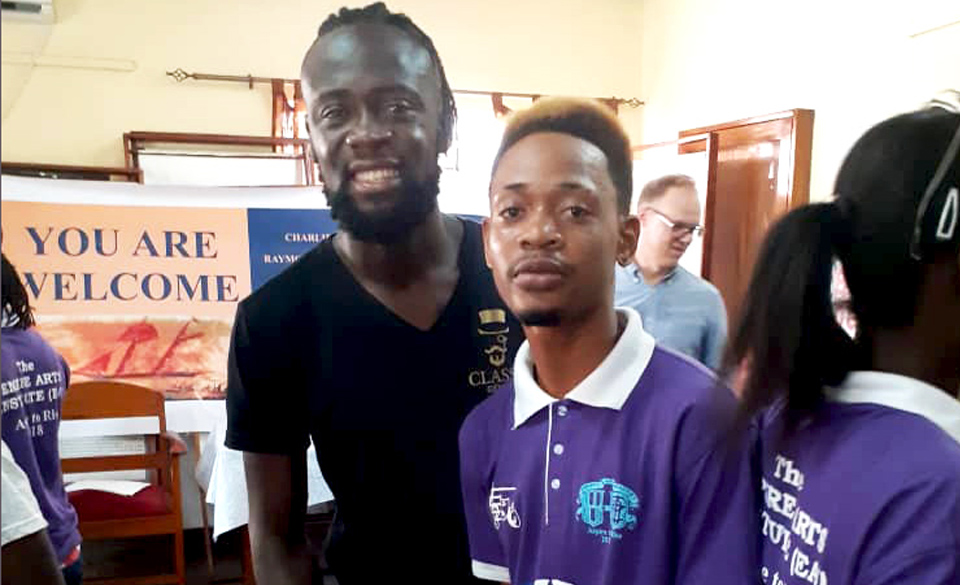 Former Houston Dynamo soccer player and current Sierra Leone National Football team forward Kei Kamara visited Dr. Matt Christensen’s workshop at the Sierra Leone National Museum to introduce himself to one of the playwrights featured in Christensen’s book. (Courtesy Photo)