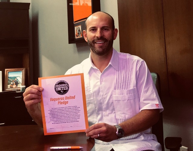 Chasse Conque, UTRGV vice president and director of Athletics, proudly shows his support of the Vaqueros United Pledge.