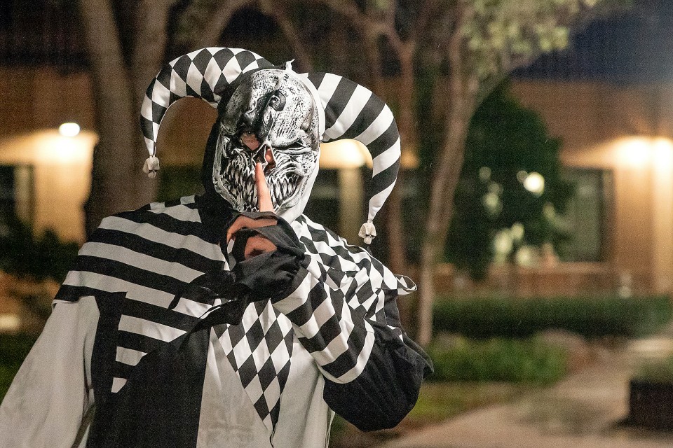 student wearing a scary juggler costume at UTRGV