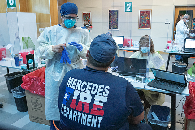 A Mercedes Fire Department first responder gets the COVID-19 vaccine Saturday, Dec. 19, 2020, at the UTRGV School of Medicine, at the UTRGV School of Medicine’s Medical Education Building on the Edinburg Campus. (UTRGV Photo by Paul Chouy)