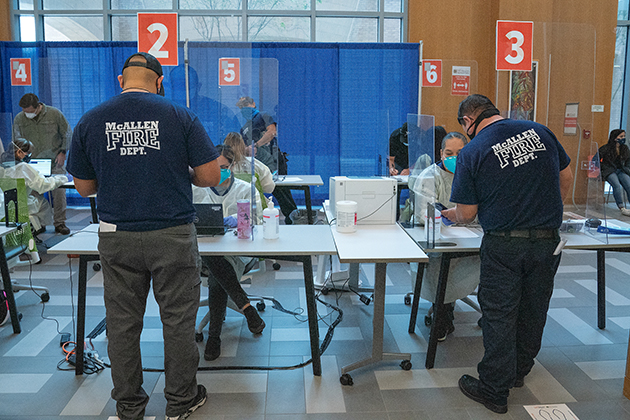 The UTRGV School of Medicine on Dec. 19, 2020, administered the COVID-19 vaccine to area EMS providers, like these from McAllen, at the UTRGV School of Medicine’s Medical Education Building on the Edinburg Campus. (UTRGV Photo by Paul Chouy)