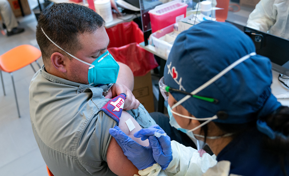 Juan De La Garza, EMT-Basic with Lifeline, received the COVID-19 vaccine Saturday, Dec. 19, 2020, at the UTRGV School of Medicine’s Medical Education Building on the Edinburg Campus. (UTRGV Photo by Paul Chouy)