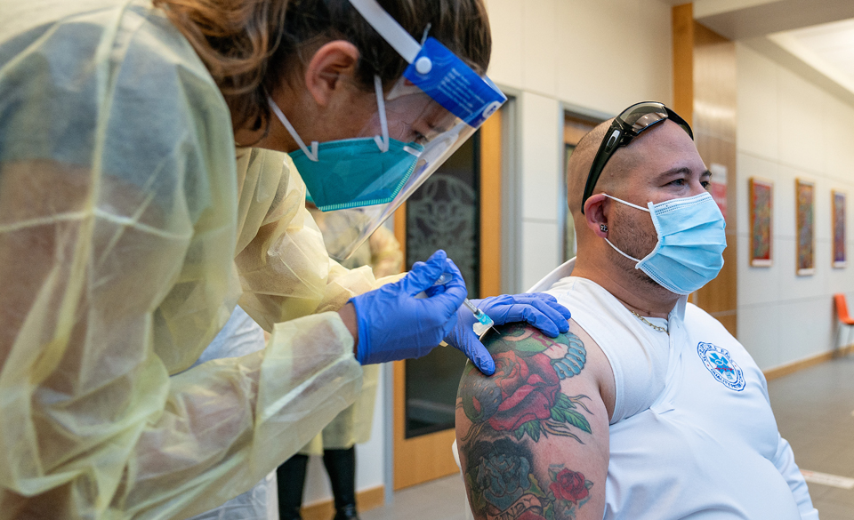 Hannah Carrillo, a second-year physician assistant studies student from South Padre Island, administers the COVID-19 vaccine on Monday, Dec. 21, during a hands-on training for UTRGV medical and physician assistant students. (UTRGV Photo by Paul Chouy)