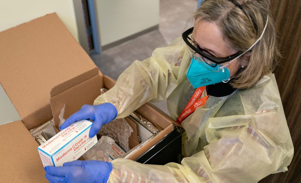 Dr. Linda Nelson, a Doctor of Nurse Practice (DNP), RN, pediatric nurse practitioner and senior director of Clinical Operations for the UTRGV School of Medicine and UT Health RGV, unpacked the boxes of Moderna COVID-19 vaccine on Monday, Dec. 28, at the UT Health RGV/Knapp Family Health Center in Mercedes, Texas. (UTRGV Photo by Paul Chouy)