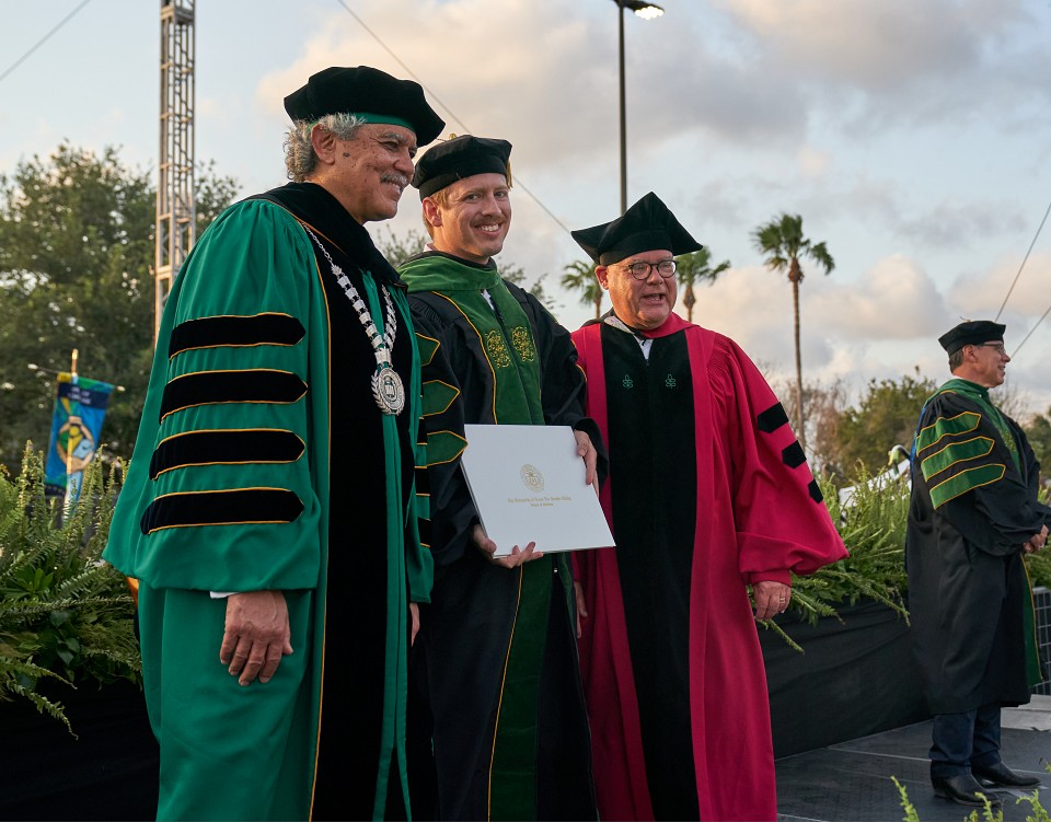 Dr. M. Roy Wilson, Graduate Student and Dr. John Krouse posing for photo