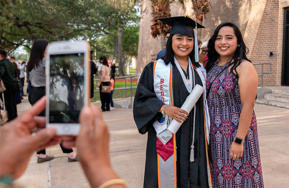 A UTRGV graduate and her family are all smiles after the Friday morning ceremony in Edinburg. (UTRGV Photo by Paul Chouy)