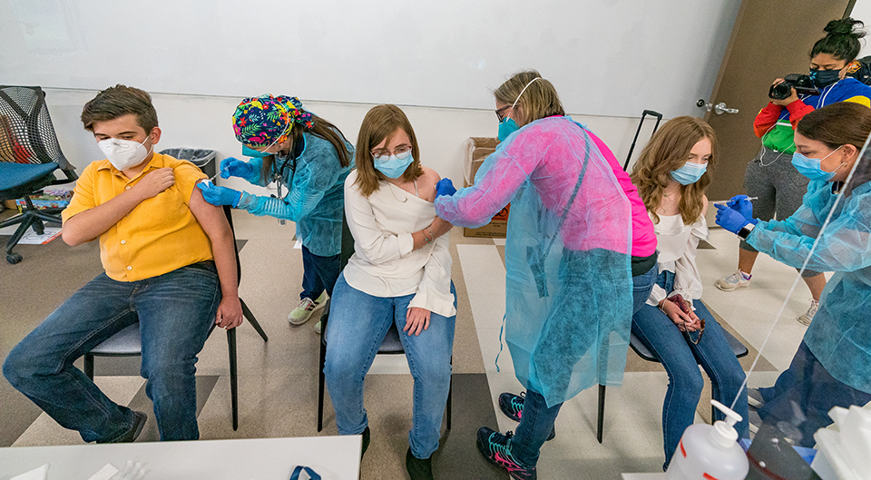 UT Health RGV began vaccinating children ages 12-15 on Wednesday evening at the UTRGV Brownsville Campus. The first to get the vaccines with UT Health RGV were the 14-year-old Strader Triplets – Logan, Madison Sage and Brooklyn – from Los Fresnos. (UTRGV Photo by David Pike)