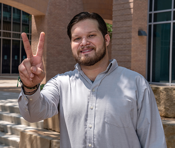 Adrian David Barrera is the first to go to college and the first doctor in his family. Barrera will begin a residency in psychiatry on July 1 at the UTRGV Psychiatry Residency Program. Eventually he plans to go into child adolescent psychiatry.  (UTRGV Photo by Paul Chouy)