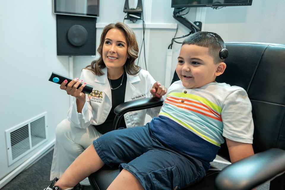 Dr. Sandy Magallan works with patient Eden Davila