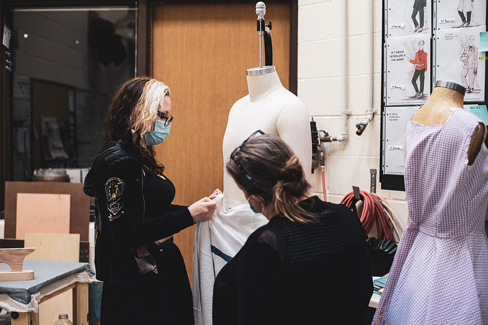 Costume design department hard at work, getting ready for the opening of 'The Weird'. 