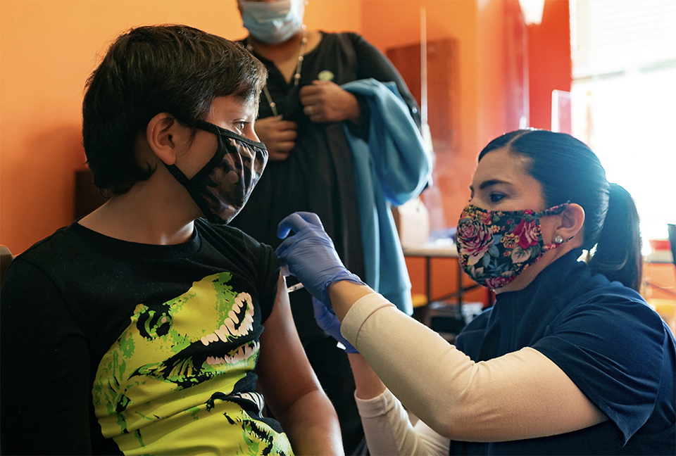 Eight-year-old Ociel Castillo receives his first dose of the pediatric Pfizer COVID-19 vaccine on Friday at a UT Health RGV pop-up vaccine site in Brownsville. (UTRGV Photo by David Pike)