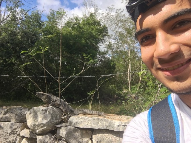 Alonso Ponce poses with an iguana