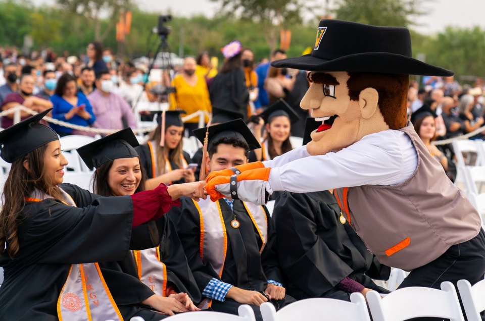 UTRGV mascot and graduates