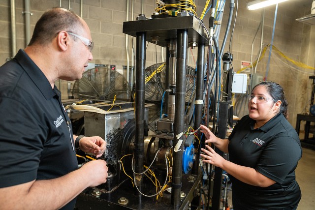 Dr. Constantine Tarawneh, senior associate dean for Research and Graduate Programs and director of the University Transportation Center for Railway Safety, and Danna Capitanachi, student academic assistant from La Joya, talks about the energy harvesting component that she worked on which is currently being tested in a UTRGV lab.