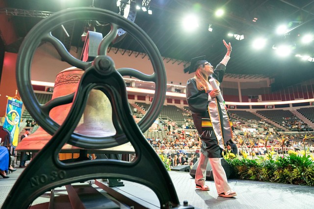 UTRGV graduate walking on stage