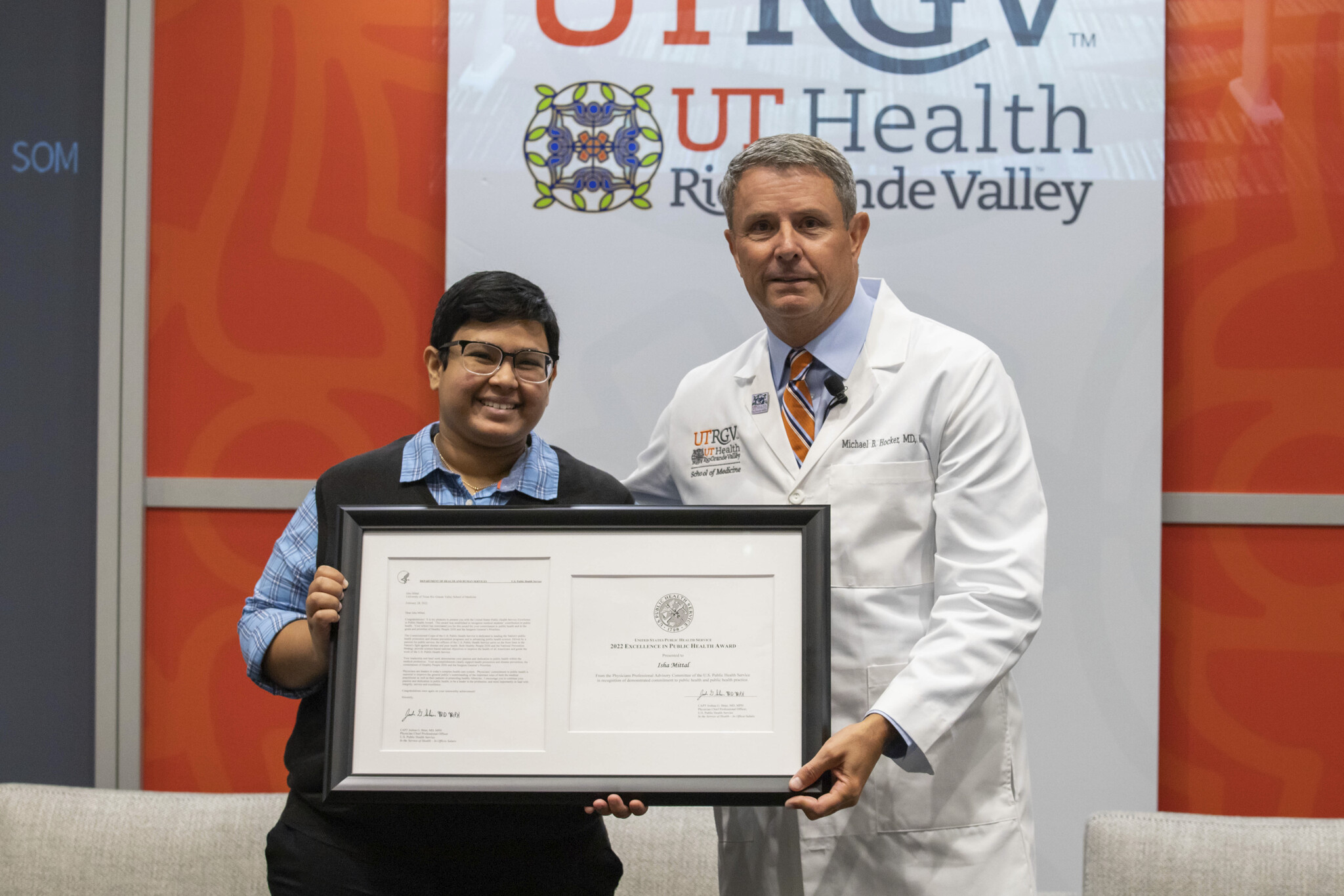 Third-year UTRGV medical student Isha Mittal and Dr. Michael Hocker, dean of the UTRGV School of Medicine, display Mittal’s recent U.S. Public Health Service Excellence in Public Health Award. (Photo by Raul Gonzalez)
