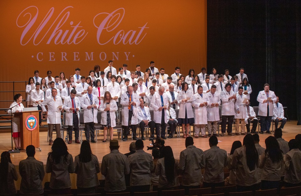 The UTRGV School of Medicine officially welcomed the Class of 2024 and 2026 with a White Coat Ceremony on Saturday, July 2, in Edinburg. The Ceremony is an important and meaningful first step in the career of future physicians. The White Coat Ceremony is a rite of passage at medical schools around the country. Pictured is Dr. Michael B. Hocker, dean of the UTRGV School of Medicine, presenting a student with their white coat for the first time.