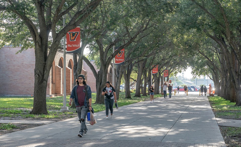 Students walking on campus on first class day