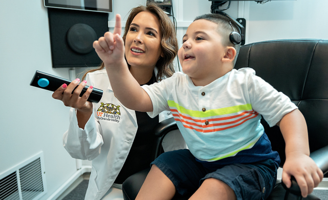 Dr. Sandy Magallan works with patient Eden Davila