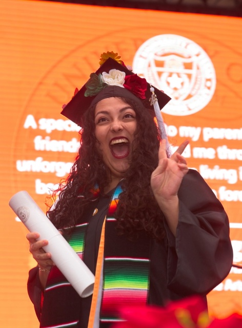 Excited grad showing the V's Up!