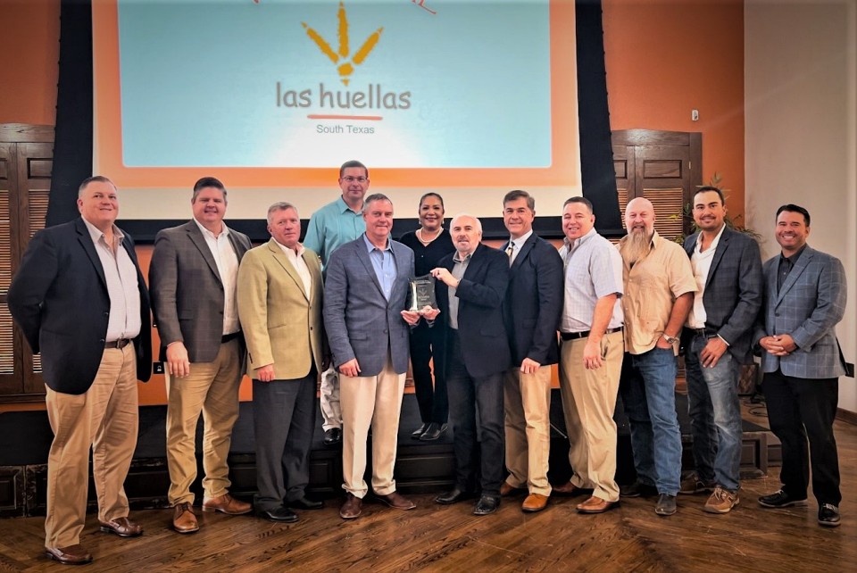 Pictured (left) are Las Huellas Association board members Ronald Humphrey and Nick Tipton, Vice President and Treasurer Russell Adams, Steve Garza, President Edward Mathers, Secretary Monica Garza, UTRGV President Guy Bailey, and board members Ricardo Adobbati, Rusty Young, Brad Wolfe, Ross Bland and Bryant Kennedy.