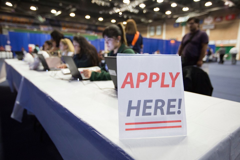 Apply here sign on table