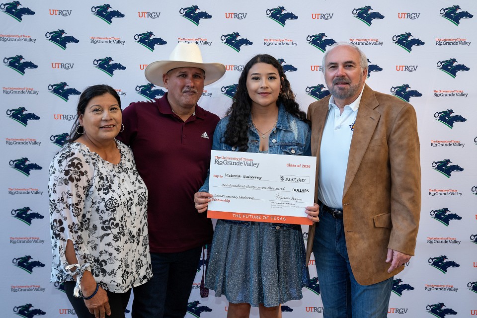 UTRGV President Guy Bailey is shown here with student Victoria Gutierrez and her family, from Port Arthur, at a signing event for Luminary Scholars recipients in 2022, at the UTRGV Visitors Center on the Edinburg Campus.