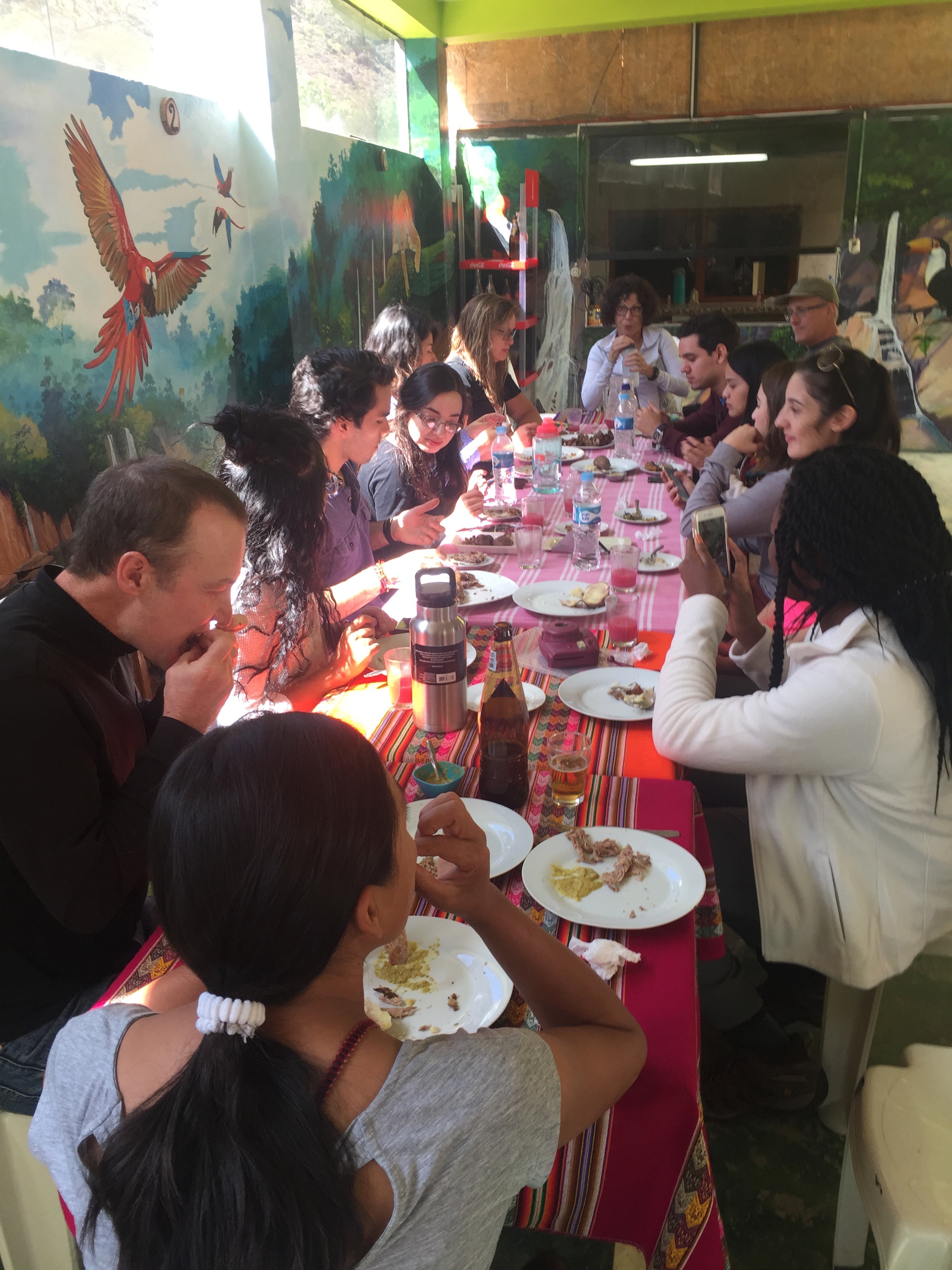 UTRGV study-abroad students and faculty eating a meal together 