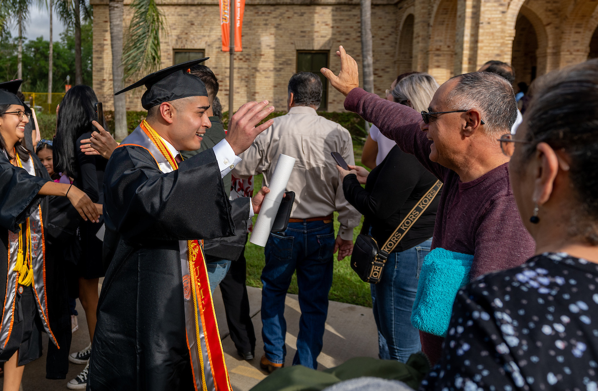 Student and family at the Fall 2023 commencement