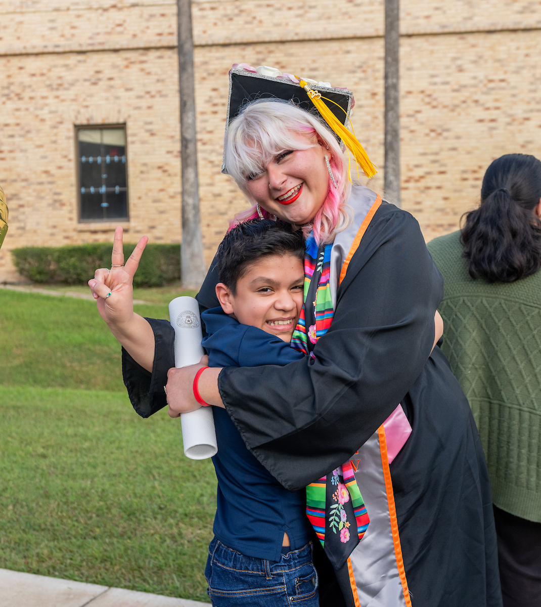 UTRGV fall 2023 commencement graduate with family