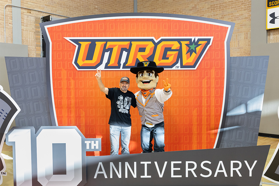 UTRGV President Guy Bailey and the Mascot celebrate 10 years of excellence at UTRGV.