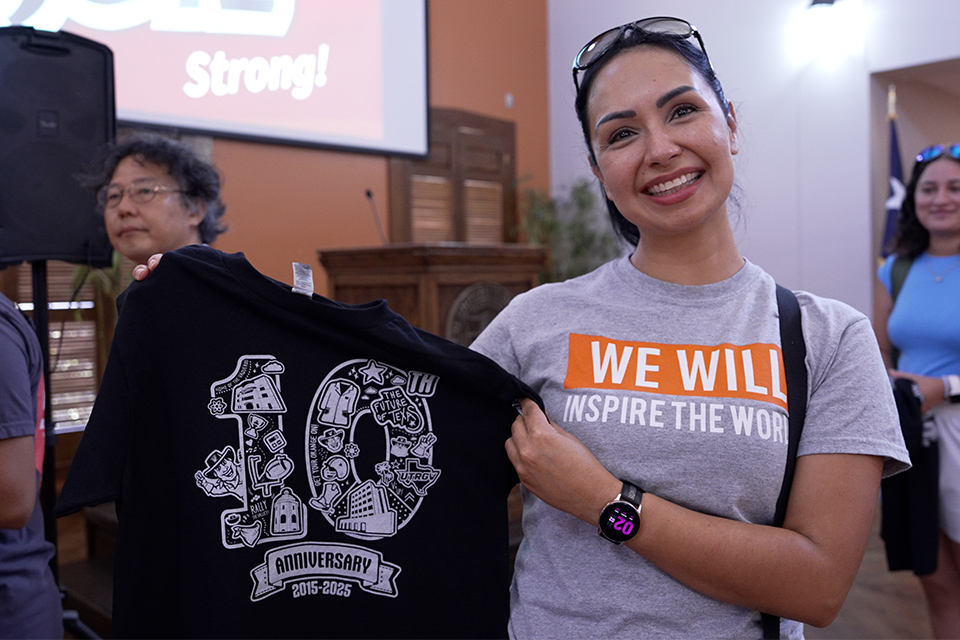 Vaquero displays new t-shirt design while wearing one of the firsts t-shirts from 10 years ago.