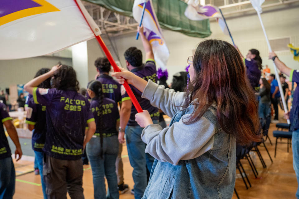 student cheering on their team