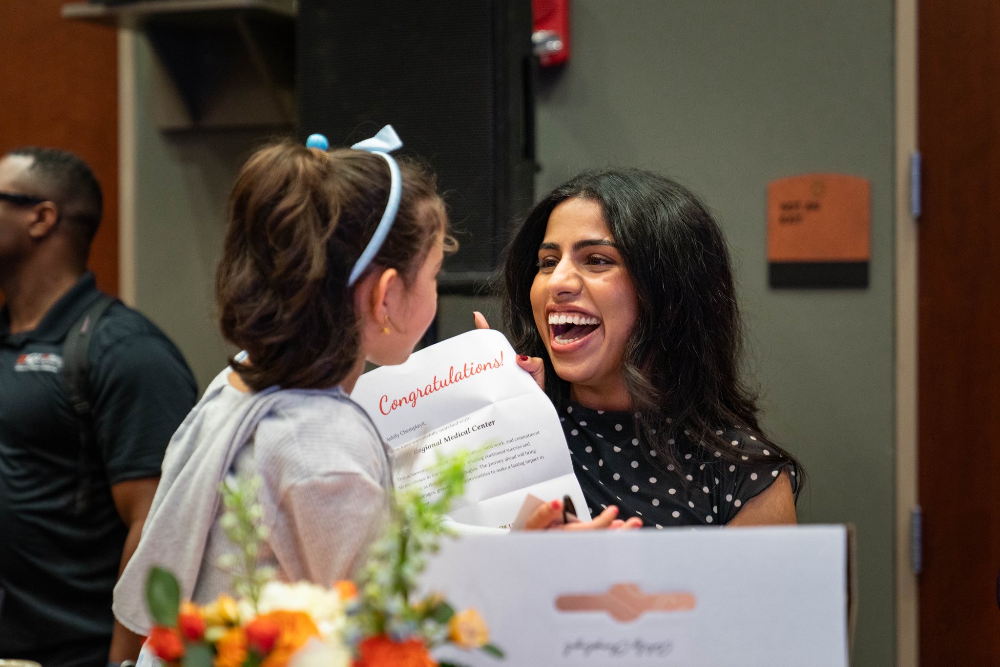 Woman celebrating and smiling with her daughter