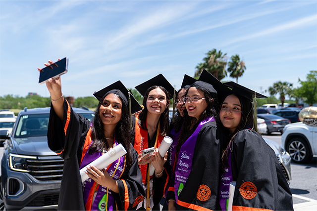 Graduates gather for a photo outside Bert Ogden Arena following Spring 2026 commencement ceremonies on May 15, 2026, in Edinburg. Commencement ceremonies for The University of Texas Rio Grande Valley continue Saturday, May 16.