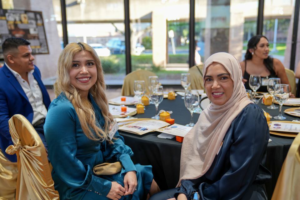 Alumni gathered at a table during the UTRGV Speech & Hearing Center's 50th anniversary gala celebration.